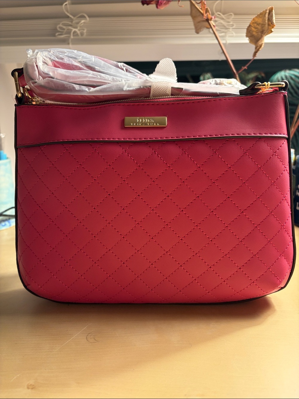 Trina Turk Quilted Pink Crossbody with Gold Plaque